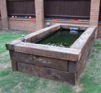 Railway ties used to frame a pond