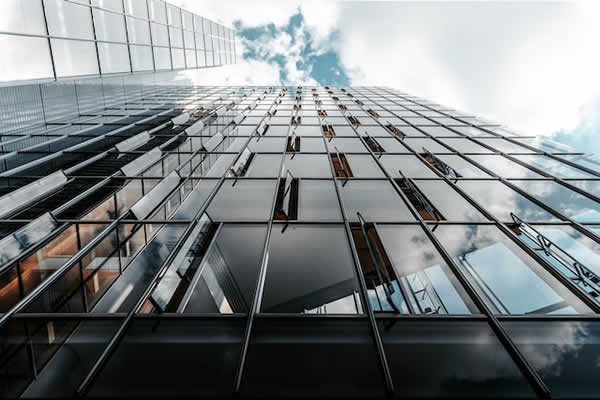 windows on tall building some are open