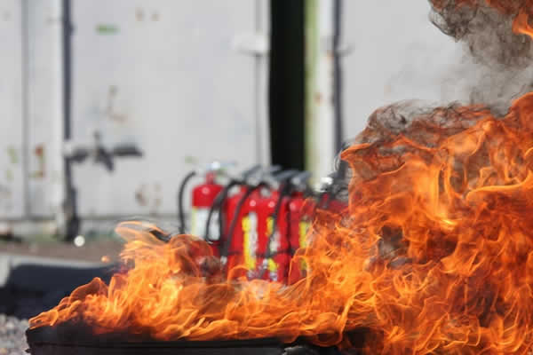 fire extingusihers behind a fire