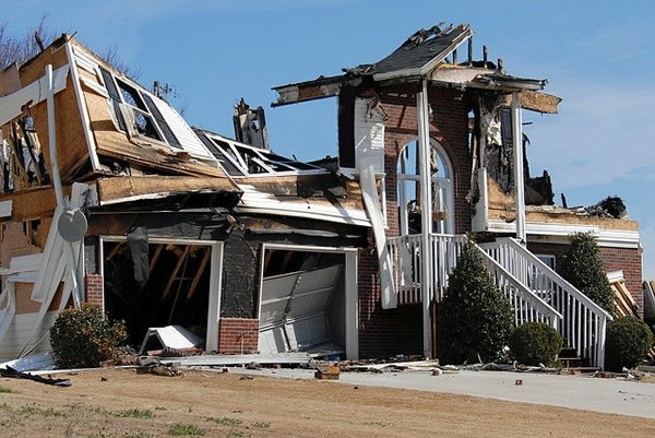 looking at house destroyed by fire