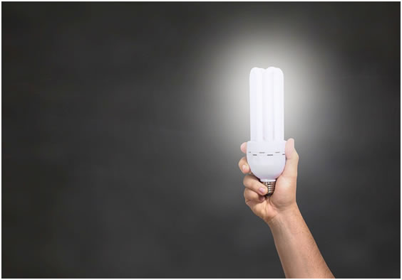lamp in hand with black background