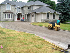 Foundation being compacted with a two drum roller
