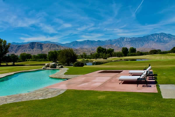 swimming pool and 2 lounge chairs