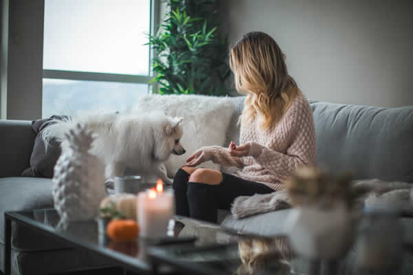 woman and dog on sofa