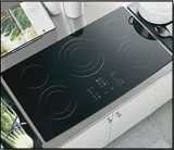 Cooktop with front burner controls