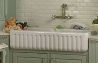 Apron sink with wall mounted kitchen faucets